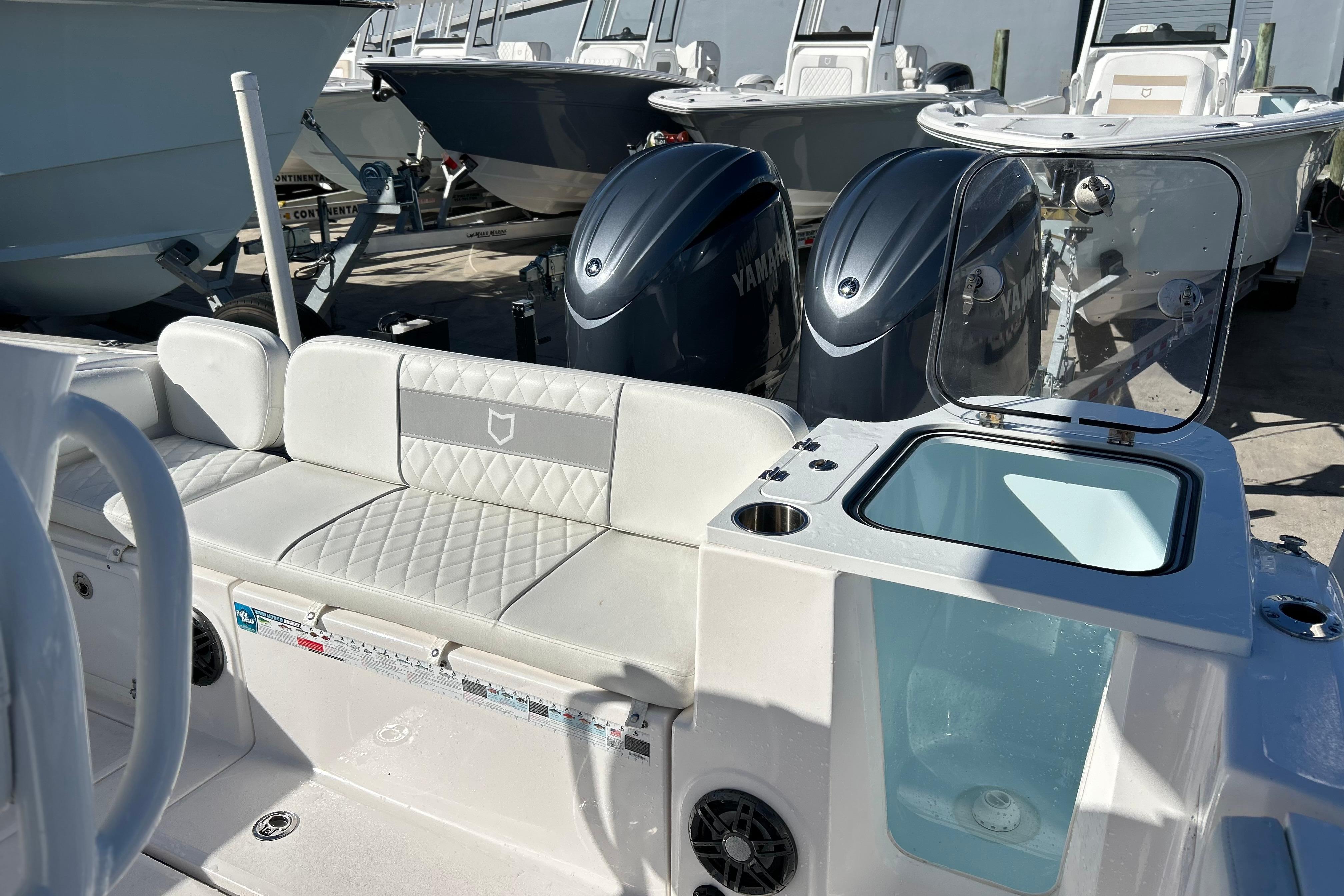 2024 Sea Fox 268 Commander boat interior with seating and Yamaha engines.