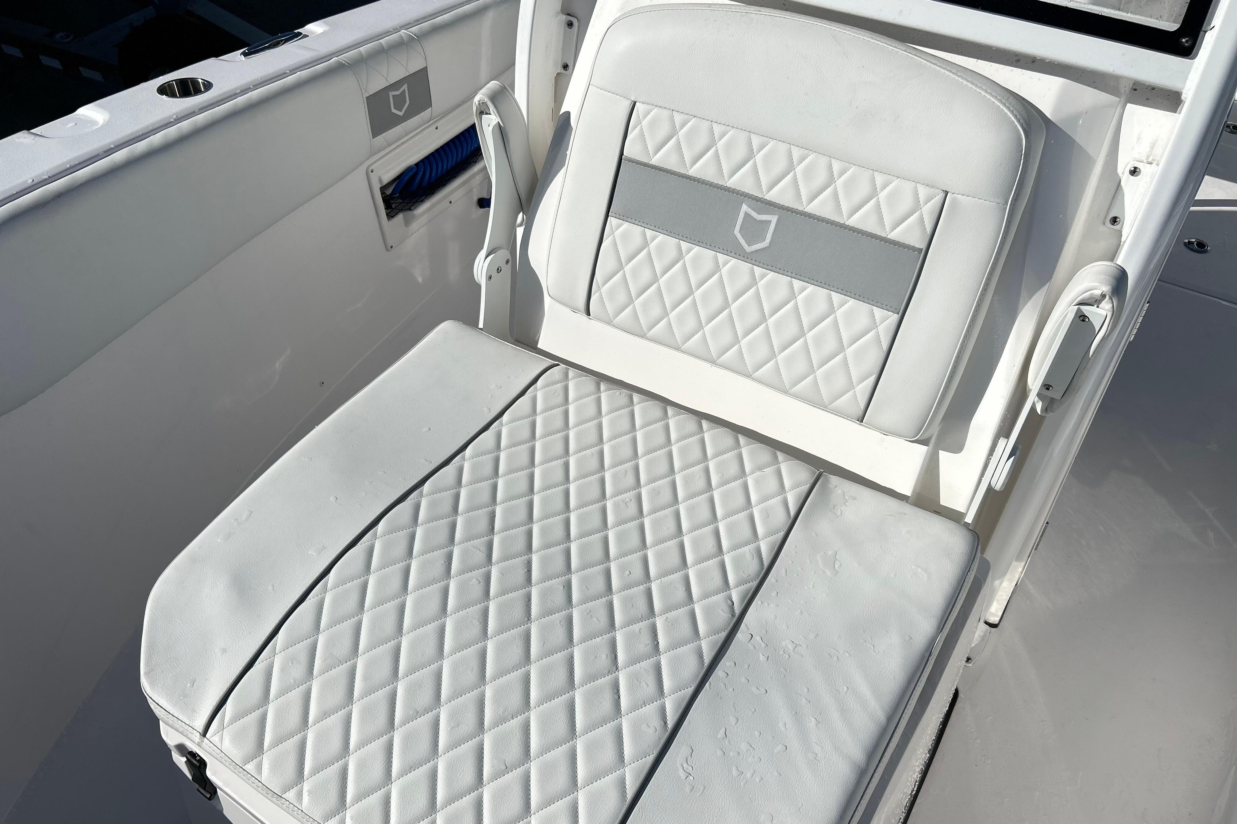 2024 Sea Fox 268 Commander boat seat with diamond-pattern upholstery.