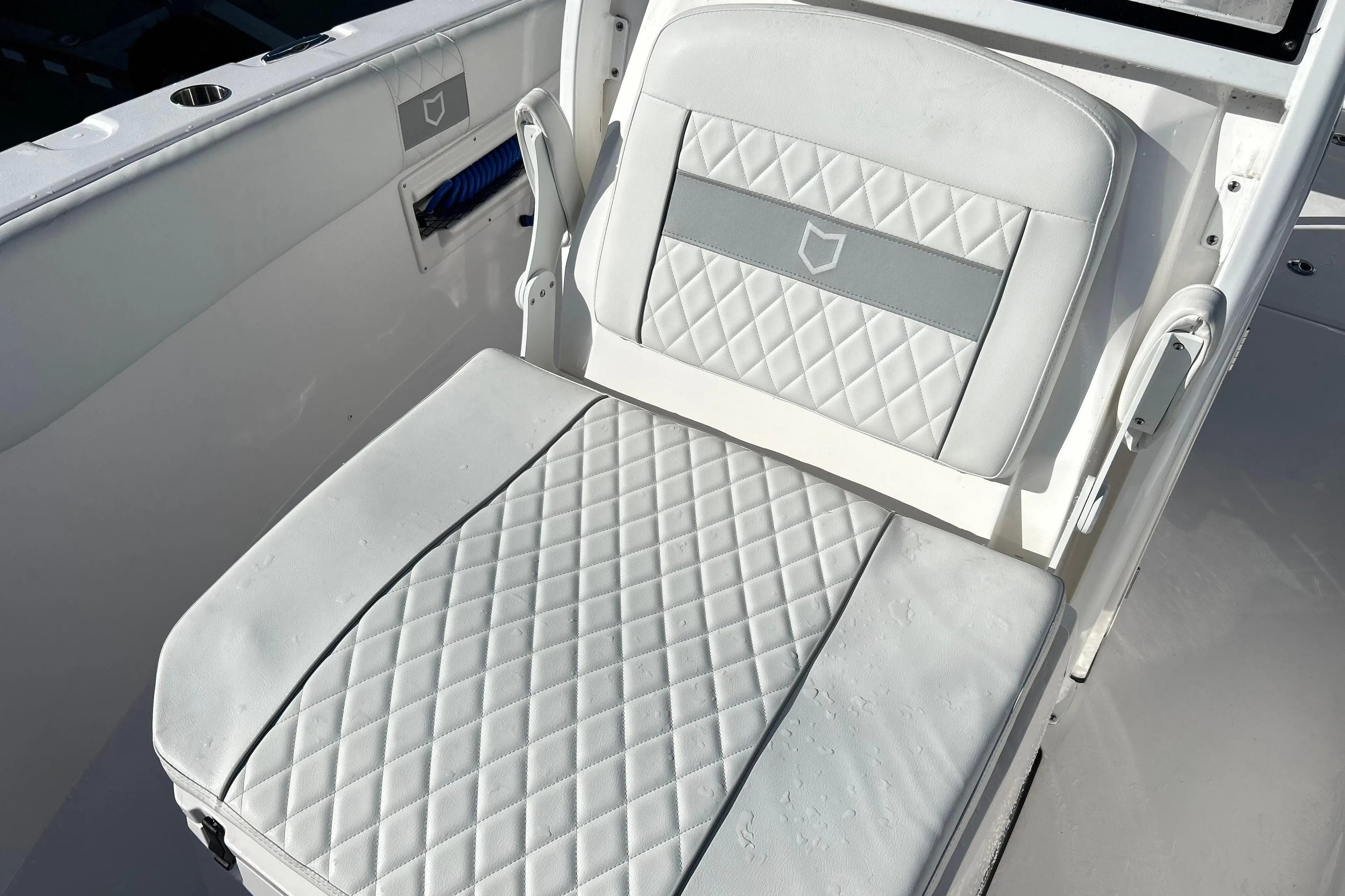 2024 Sea Fox 268 Commander boat seat with diamond-pattern upholstery.