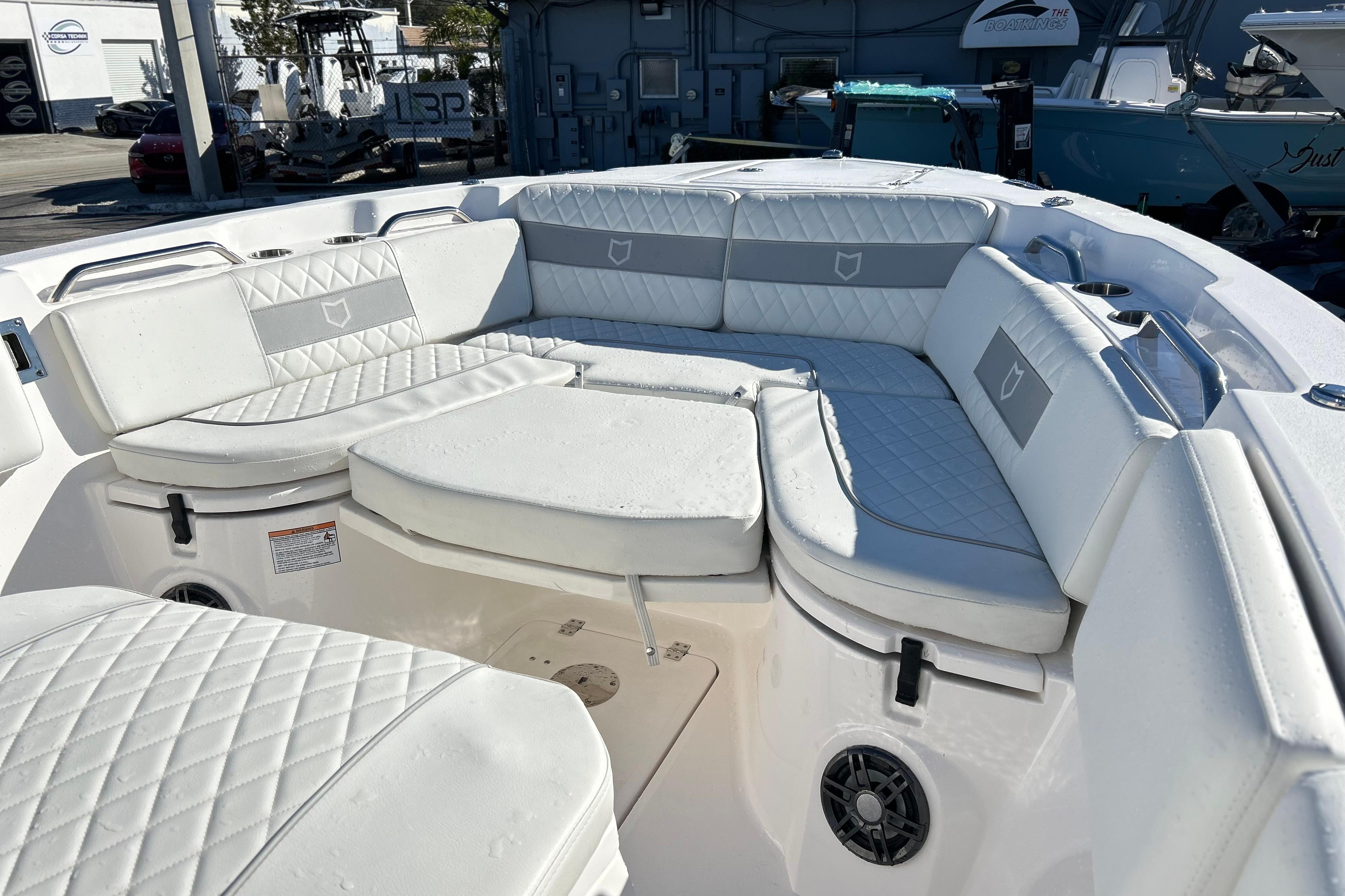 2024 Sea Fox 268 Commander boat interior with white cushioned seating.