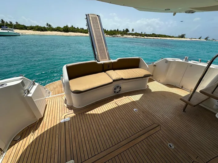  Yacht Photos Pics Luxury 2006 Fairline Squadron 58 yacht deck with seating, overlooking turquoise waters.