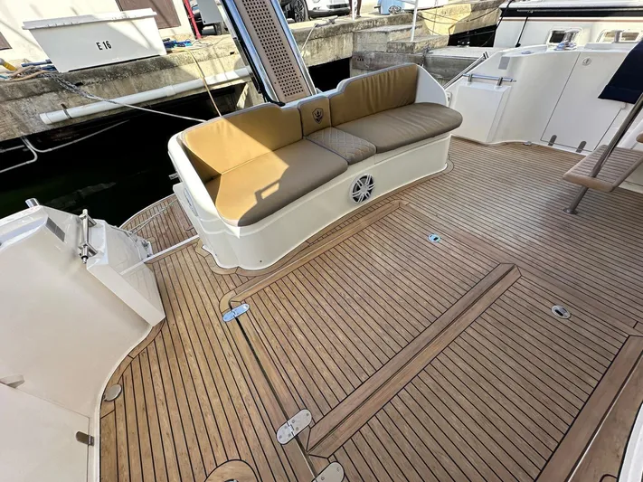  Yacht Photos Pics 2006 Fairline Squadron 58 yacht deck with cushioned seating and teak flooring.