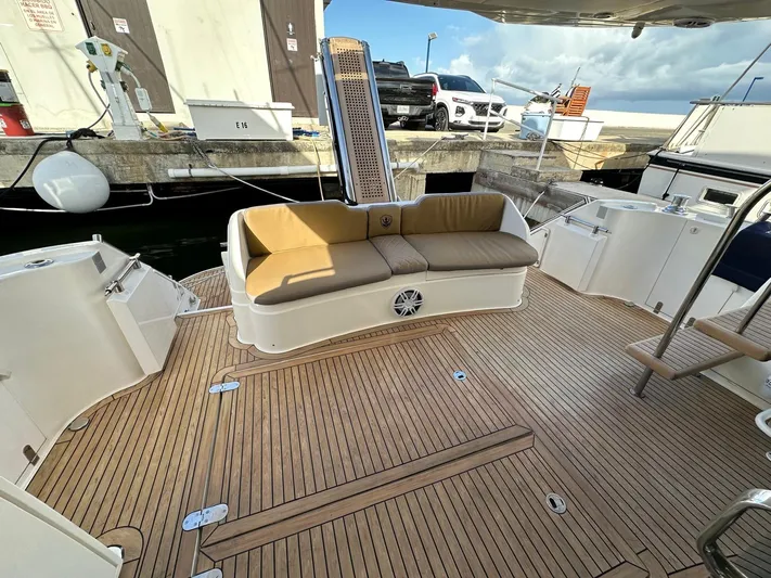  Yacht Photos Pics Fairline Squadron 58 yacht deck, 2006 model, featuring teak flooring and cushioned seating.