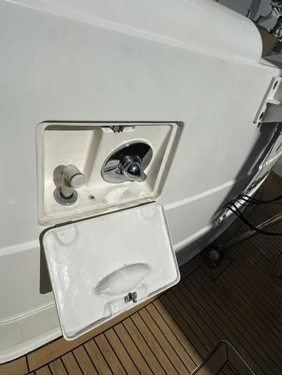  Yacht Photos Pics 2006 Fairline Squadron 58 yacht deck with open storage compartment.