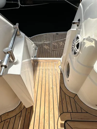  Yacht Photos Pics Teak deck of 2006 Fairline Squadron 58 yacht, featuring sleek design and stainless steel railings.