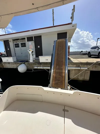  Yacht Photos Pics Fairline Squadron 58 yacht, 2006 model, docked with gangway extended under sunny skies.