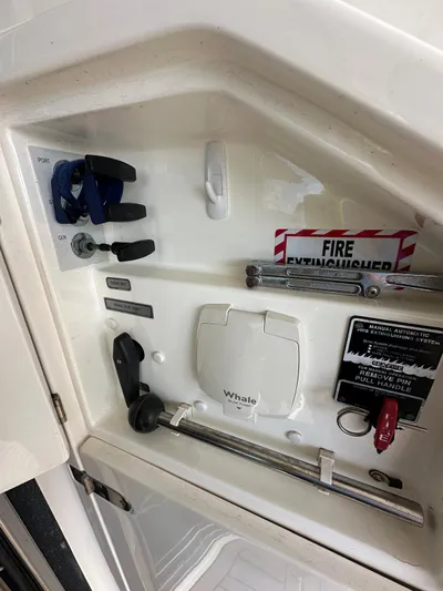  Yacht Photos Pics Control panel of 2006 Fairline Squadron 58 yacht with fire extinguisher and safety equipment.