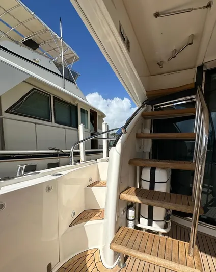  Yacht Photos Pics 2006 Fairline Squadron 58 yacht with wooden stairs and sleek design.