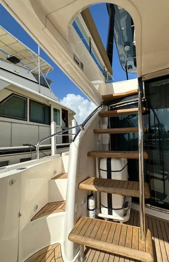  Yacht Photos Pics Staircase on 2006 Fairline Squadron 58 yacht, featuring wooden steps and sleek design.