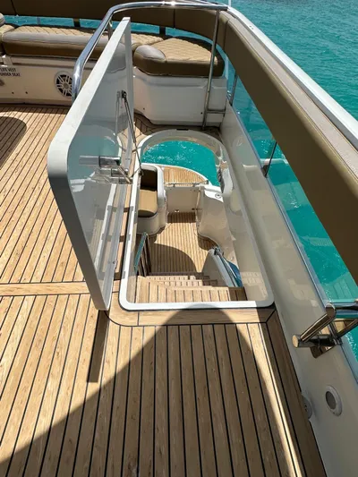  Yacht Photos Pics Fairline Squadron 58 yacht deck with open hatch, 2006 model, overlooking turquoise water.