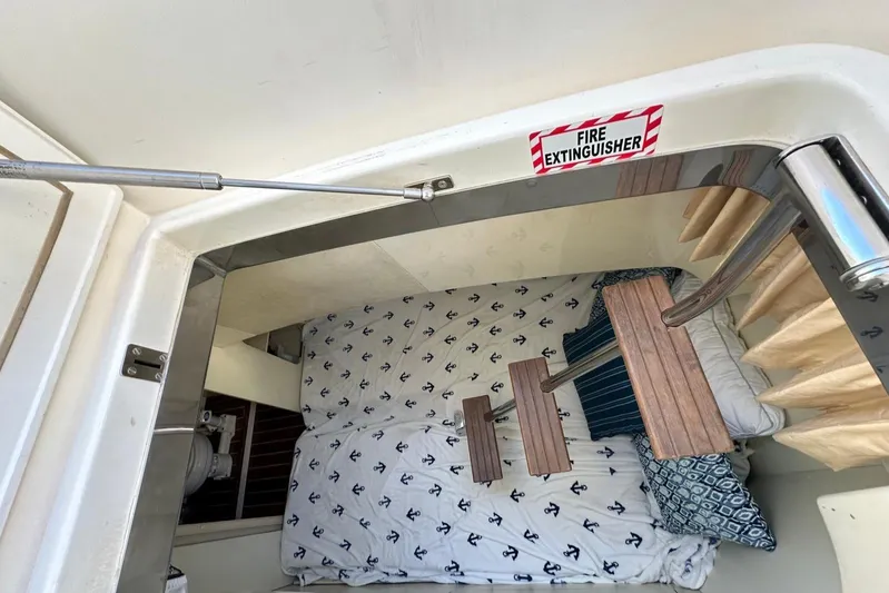  Yacht Photos Pics Interior cabin of 2006 Fairline Squadron 58 yacht with anchor-patterned bedding.