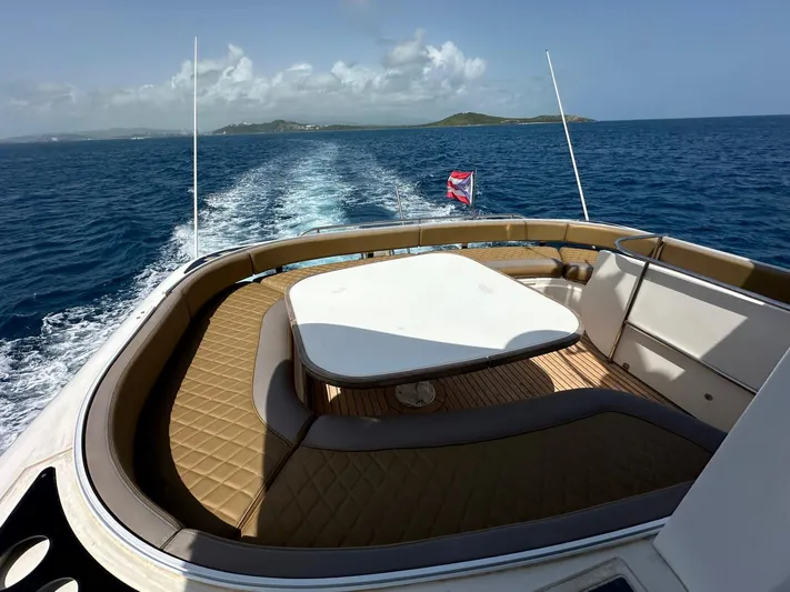  Yacht Photos Pics Fairline Squadron 58 yacht, 2006 model, cruising on open sea with scenic island view.