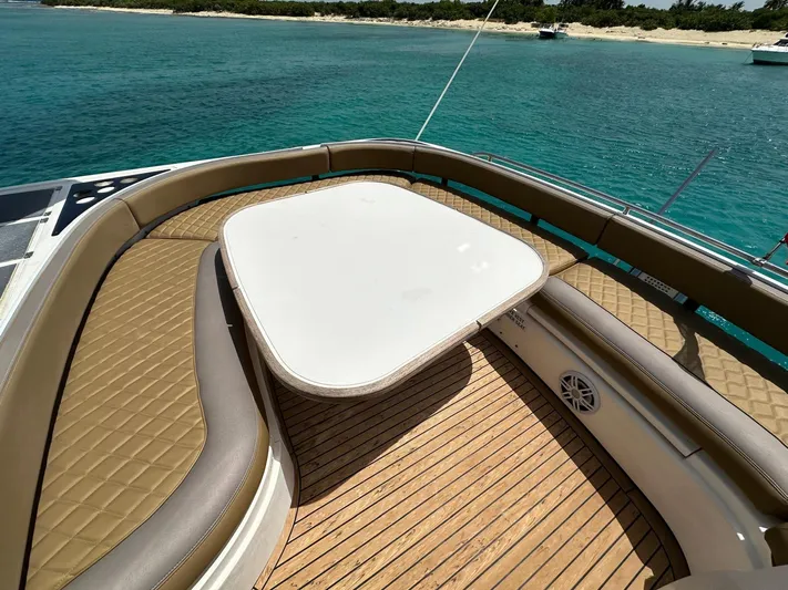  Yacht Photos Pics Luxury seating area on 2006 Fairline Squadron 58 yacht, overlooking turquoise waters.
