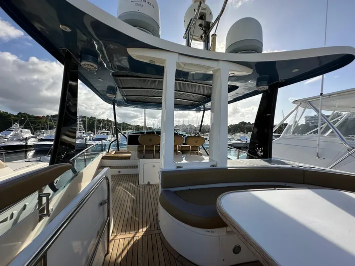  Yacht Photos Pics Luxury 2006 Fairline Squadron 58 yacht interior with seating and wooden deck.