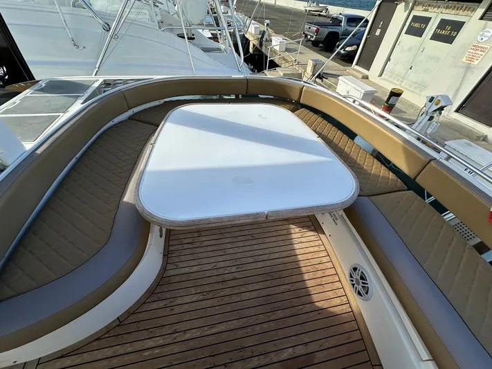  Yacht Photos Pics Luxury seating area on 2006 Fairline Squadron 58 yacht with wooden deck.