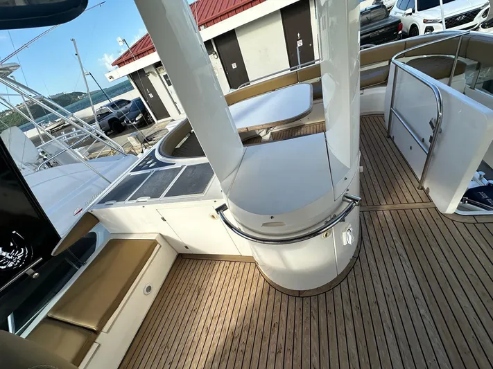  Yacht Photos Pics 2006 Fairline Squadron 58 yacht deck with seating and wood flooring.