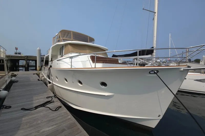 Wa Yacht Photos Pics 2012 Beneteau Swift Trawler 52 docked at marina, showcasing sleek design and luxury features.