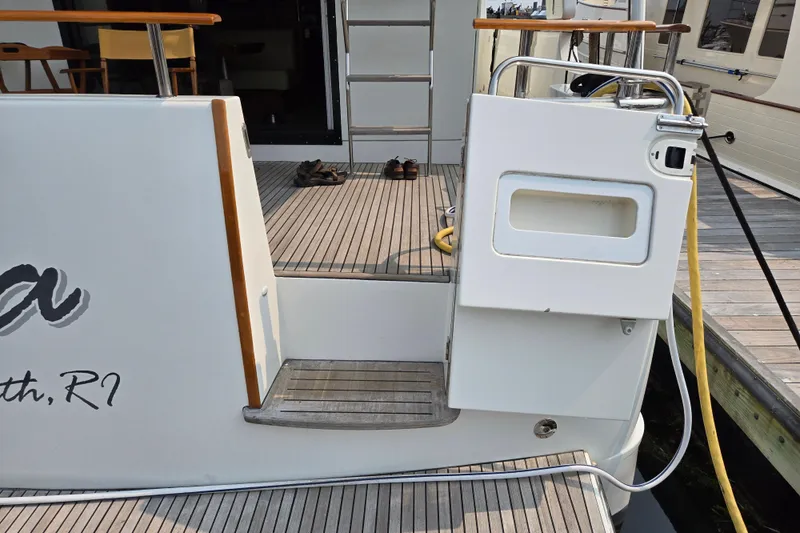 Wa Yacht Photos Pics 2012 Beneteau Swift Trawler 52 yacht stern with deck and boarding gate.