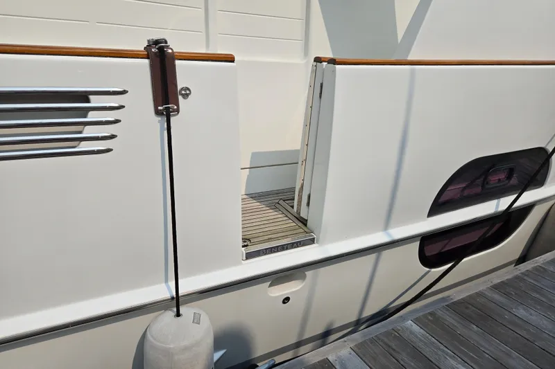 Wa Yacht Photos Pics 2012 Beneteau Swift Trawler 52 side view with open gate and dock fender.