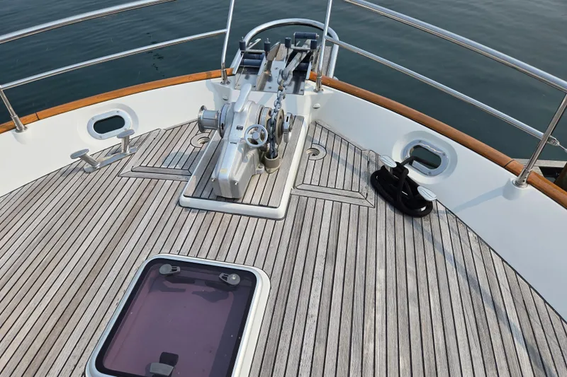 Wa Yacht Photos Pics Bow deck of 2012 Beneteau Swift Trawler 52 with anchor winch and teak flooring.