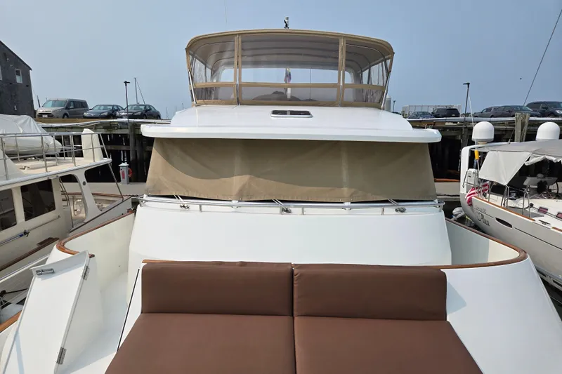 Wa Yacht Photos Pics 2012 Beneteau Swift Trawler 52 docked, featuring spacious deck and flybridge enclosure.