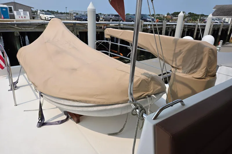 Wa Yacht Photos Pics 2012 Beneteau Swift Trawler 52 with covered equipment on deck at a marina.