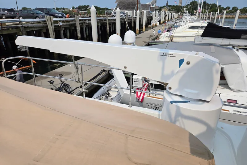 Wa Yacht Photos Pics Beneteau Swift Trawler 52, 2012 model, docked with crane arm visible.