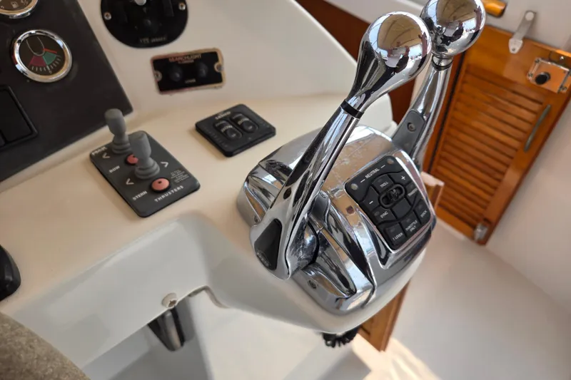 Wa Yacht Photos Pics Control panel of a 2012 Beneteau Swift Trawler 52 with throttle levers and navigation controls.