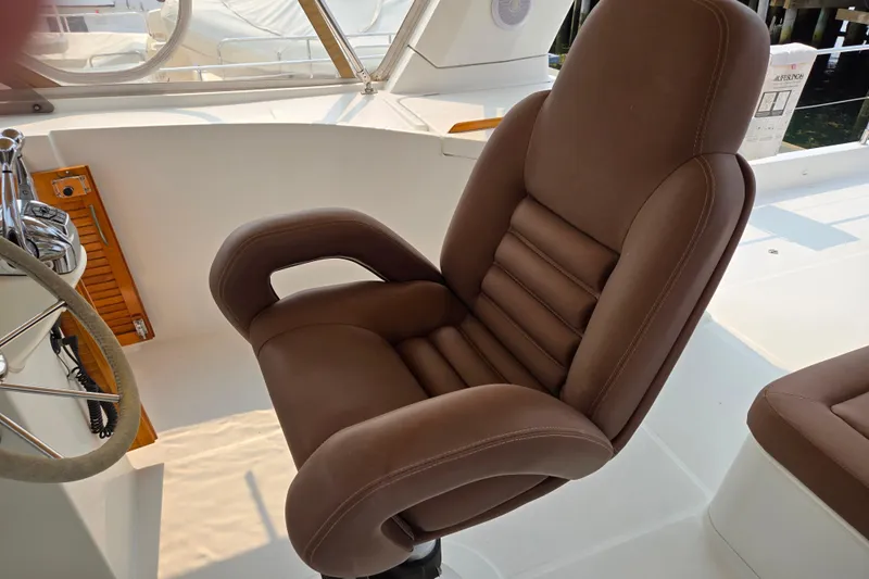 Wa Yacht Photos Pics Luxurious brown captain's chair on 2012 Beneteau Swift Trawler 52 yacht.