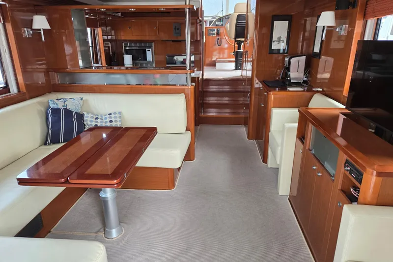 Wa Yacht Photos Pics Luxurious interior of 2012 Beneteau Swift Trawler 52 with elegant wood finishes and seating.