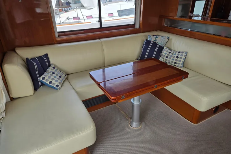 Wa Yacht Photos Pics Luxurious interior of 2012 Beneteau Swift Trawler 52 with elegant seating and wooden table.