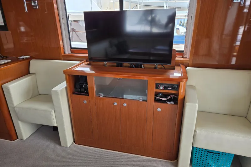Wa Yacht Photos Pics Interior of 2012 Beneteau Swift Trawler 52 with TV and seating area.