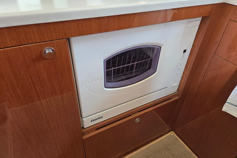 Wa Yacht Photos Pics Built-in Danby appliance in 2012 Beneteau Swift Trawler 52, wooden cabinetry.