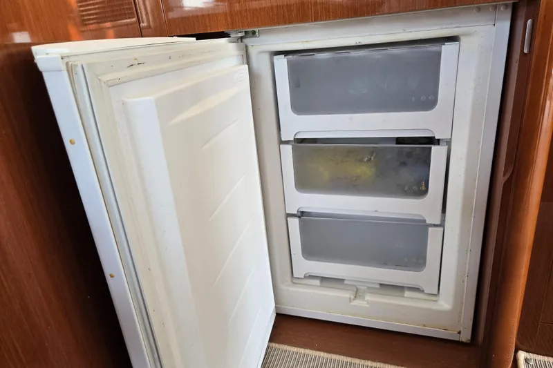Wa Yacht Photos Pics Open freezer with three compartments on a 2012 Beneteau Swift Trawler 52 yacht.
