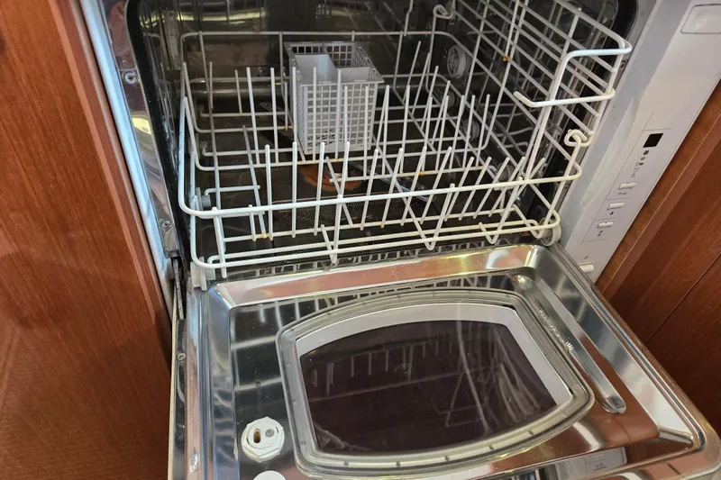 Wa Yacht Photos Pics Dishwasher inside 2012 Beneteau Swift Trawler 52 yacht, open with visible racks.