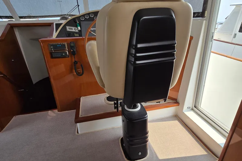 Wa Yacht Photos Pics Captain's chair and helm controls on 2012 Beneteau Swift Trawler 52 yacht.