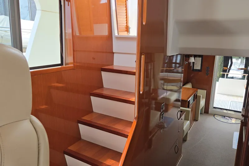 Wa Yacht Photos Pics Interior of 2012 Beneteau Swift Trawler 52, featuring wooden stairs and modern design elements.