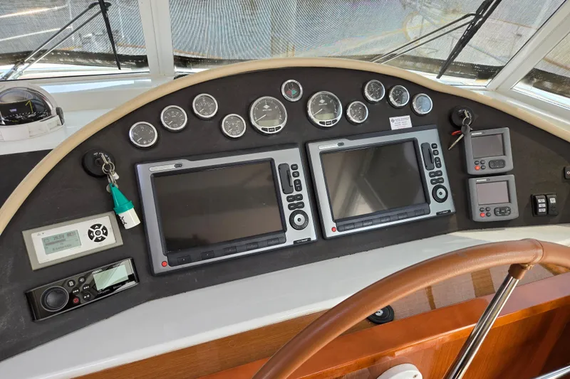 Wa Yacht Photos Pics Control panel of a 2012 Beneteau Swift Trawler 52 with navigation screens and gauges.