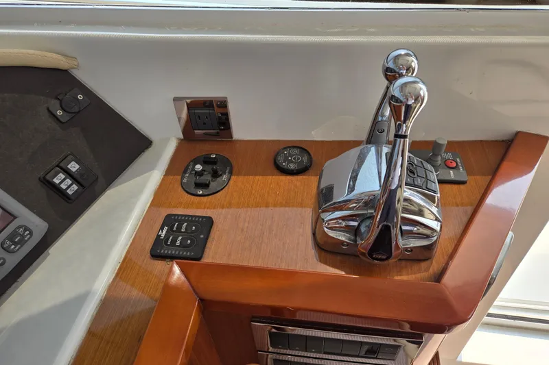 Wa Yacht Photos Pics Control panel of a 2012 Beneteau Swift Trawler 52 with throttle levers and switches.