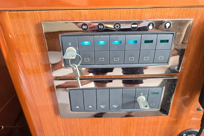 Wa Yacht Photos Pics Control panel on a 2012 Beneteau Swift Trawler 52 with key switches and buttons.