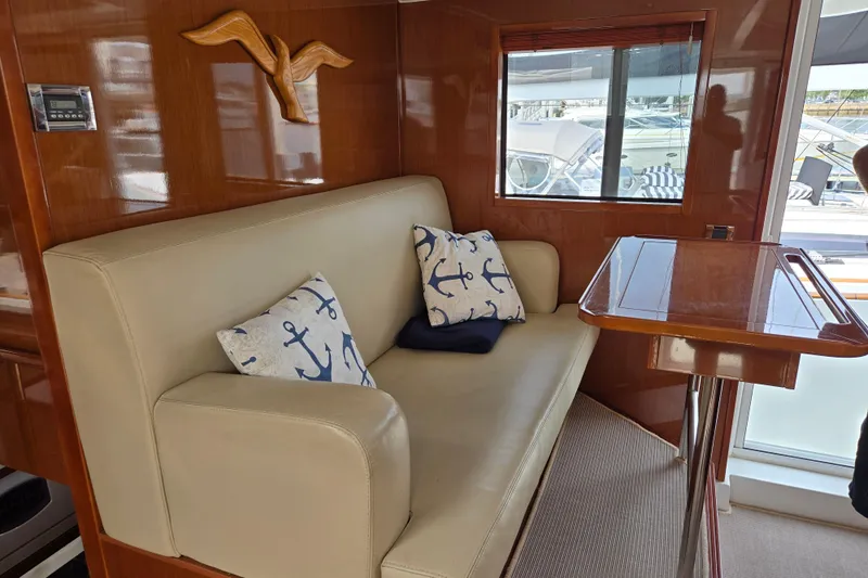 Wa Yacht Photos Pics Luxurious interior of 2012 Beneteau Swift Trawler 52 with anchor-themed cushions.