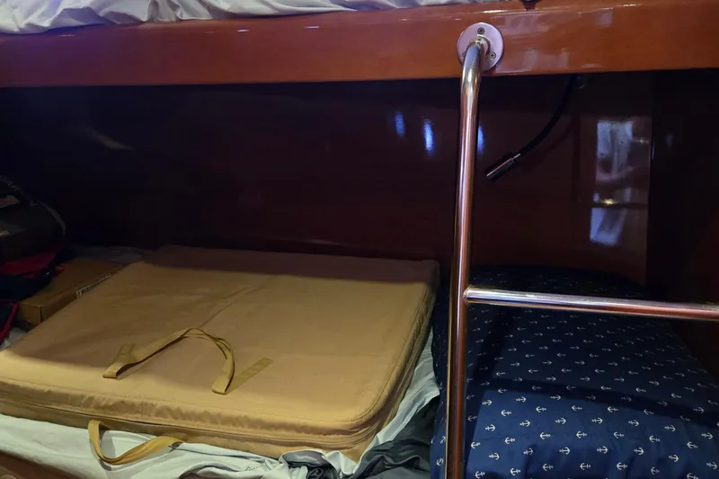 Wa Yacht Photos Pics Bunk bed area in 2012 Beneteau Swift Trawler 52 with ladder and storage.
