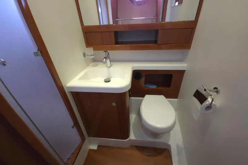 Wa Yacht Photos Pics Bathroom interior of 2012 Beneteau Swift Trawler 52 with sink and toilet.