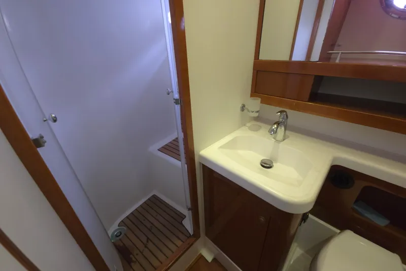 Wa Yacht Photos Pics Bathroom interior of 2012 Beneteau Swift Trawler 52 with shower and sink.