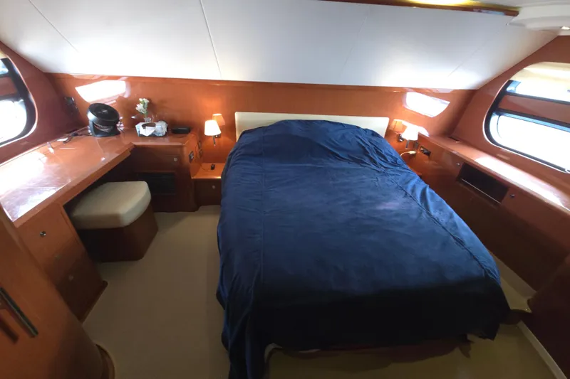Wa Yacht Photos Pics Luxurious cabin interior of 2012 Beneteau Swift Trawler 52 with cozy bed and wooden furnishings.