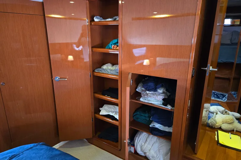 Wa Yacht Photos Pics Interior of 2012 Beneteau Swift Trawler 52 with wooden cabinets and shelves.