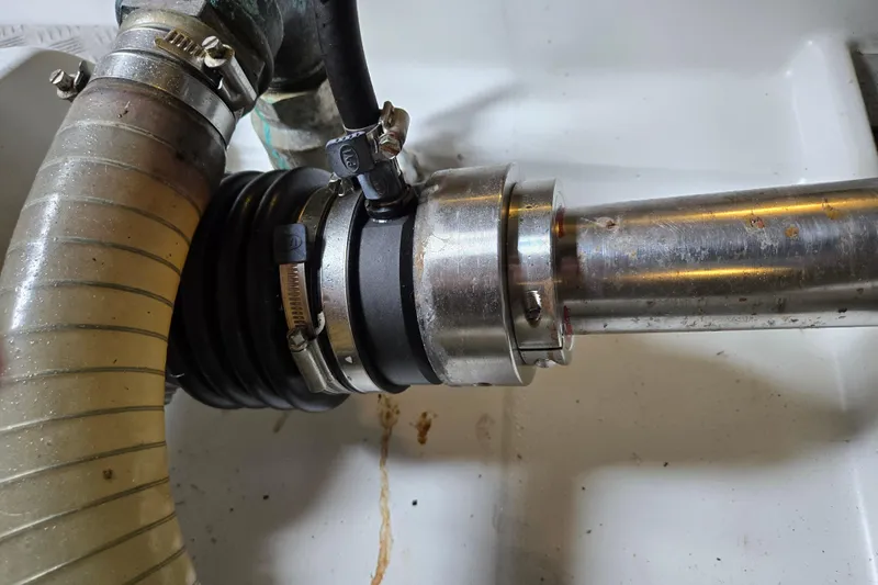 Wa Yacht Photos Pics Close-up of a Beneteau Swift Trawler 52's 2012 engine component with hose and clamps.