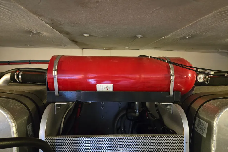 Wa Yacht Photos Pics Engine room of 2012 Beneteau Swift Trawler 52 with red fire extinguisher.