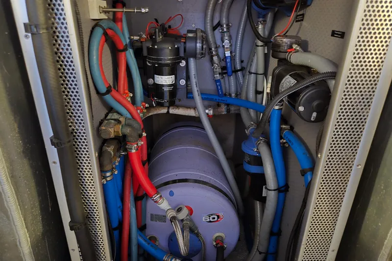 Wa Yacht Photos Pics Engine room of 2012 Beneteau Swift Trawler 52 with complex piping and machinery.