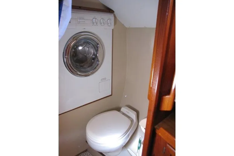 Bella Yacht Photos Pics Laundry area with washer and toilet in 1983 Nauticat 43 yacht.